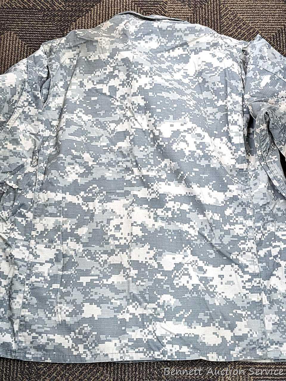 US Military Army digital camouflage combat uniform and two extra coats of the same type. All coats