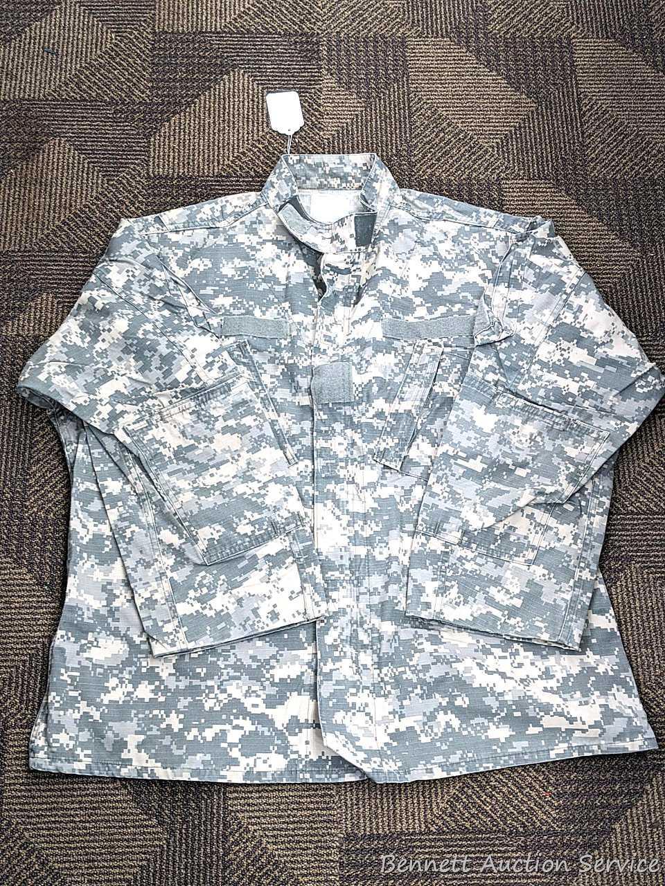 US Military Army digital camouflage combat uniform and two extra coats of the same type. All coats