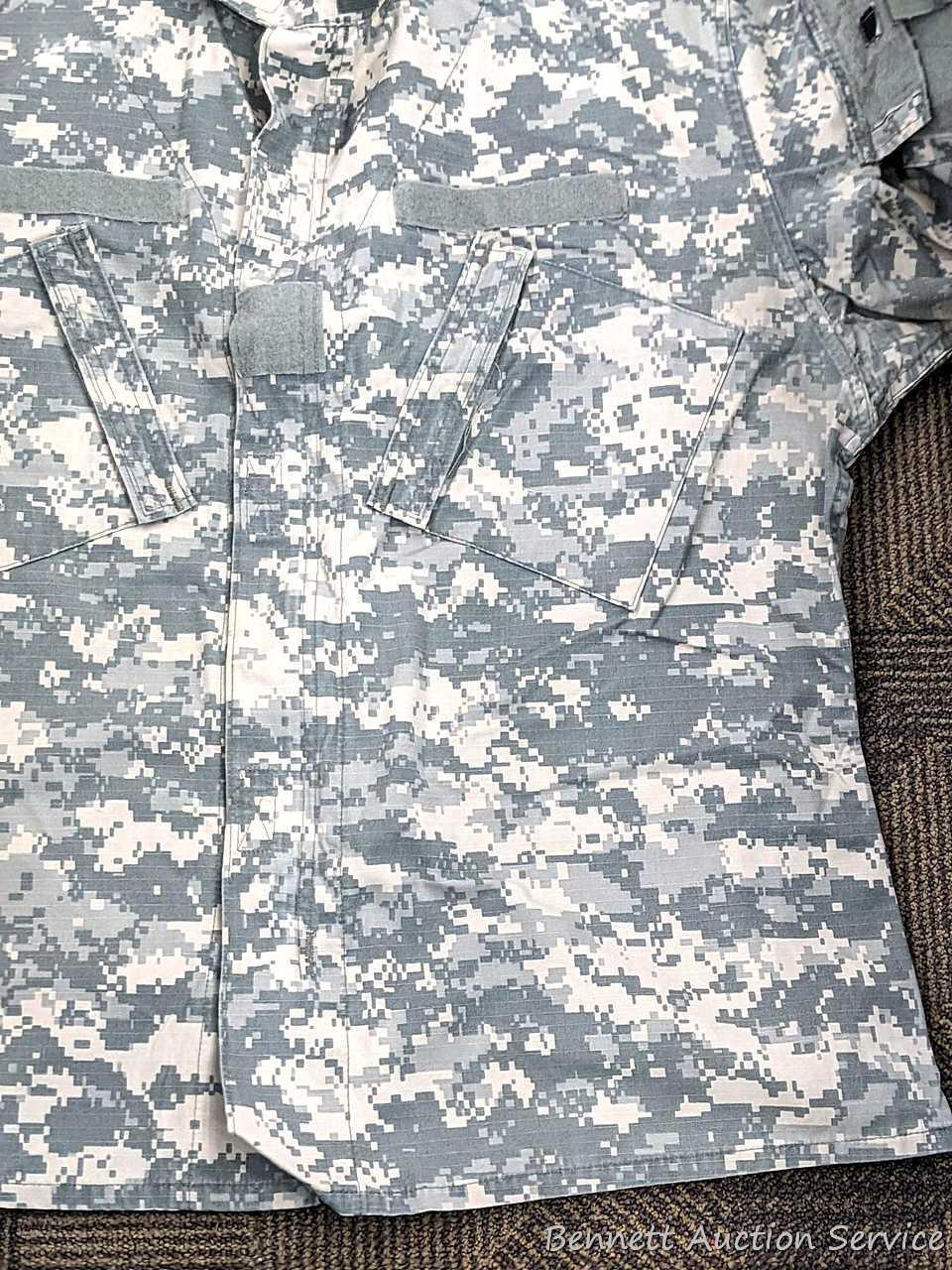 US Military Army digital camouflage combat uniform and two extra coats of the same type. All coats