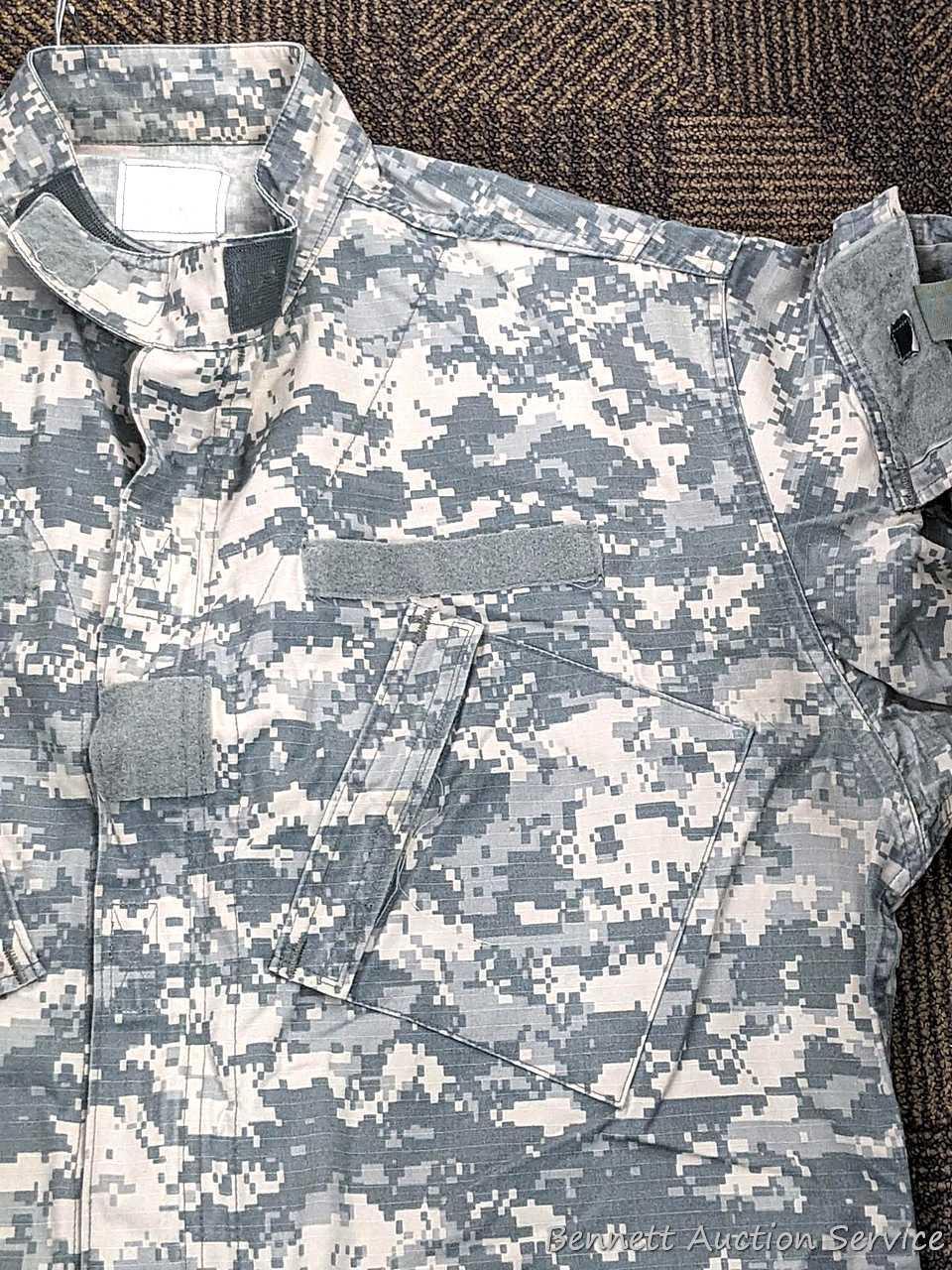 US Military Army digital camouflage combat uniform and two extra coats of the same type. All coats
