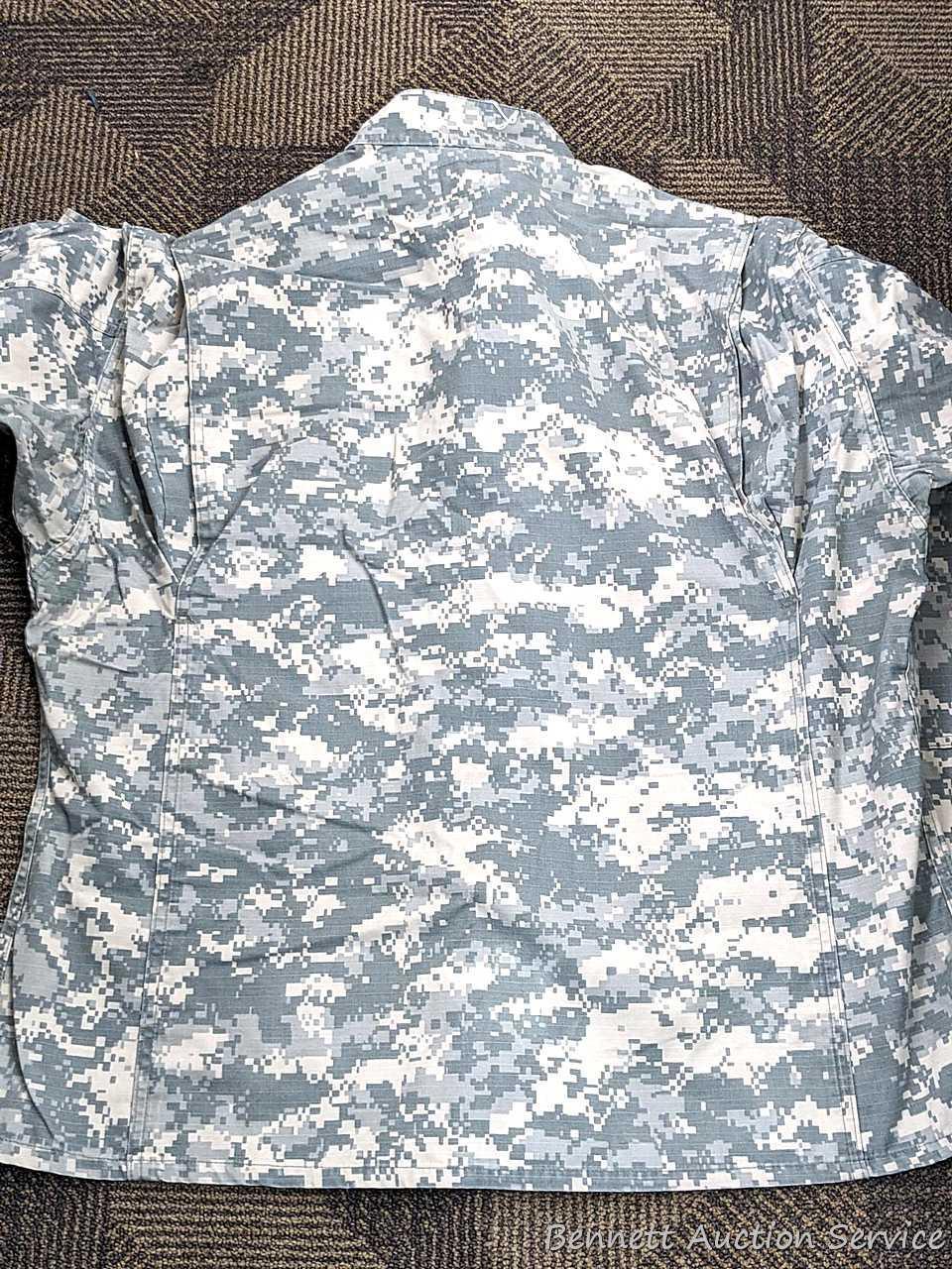US Military Army digital camouflage combat uniform and two extra coats of the same type. All coats