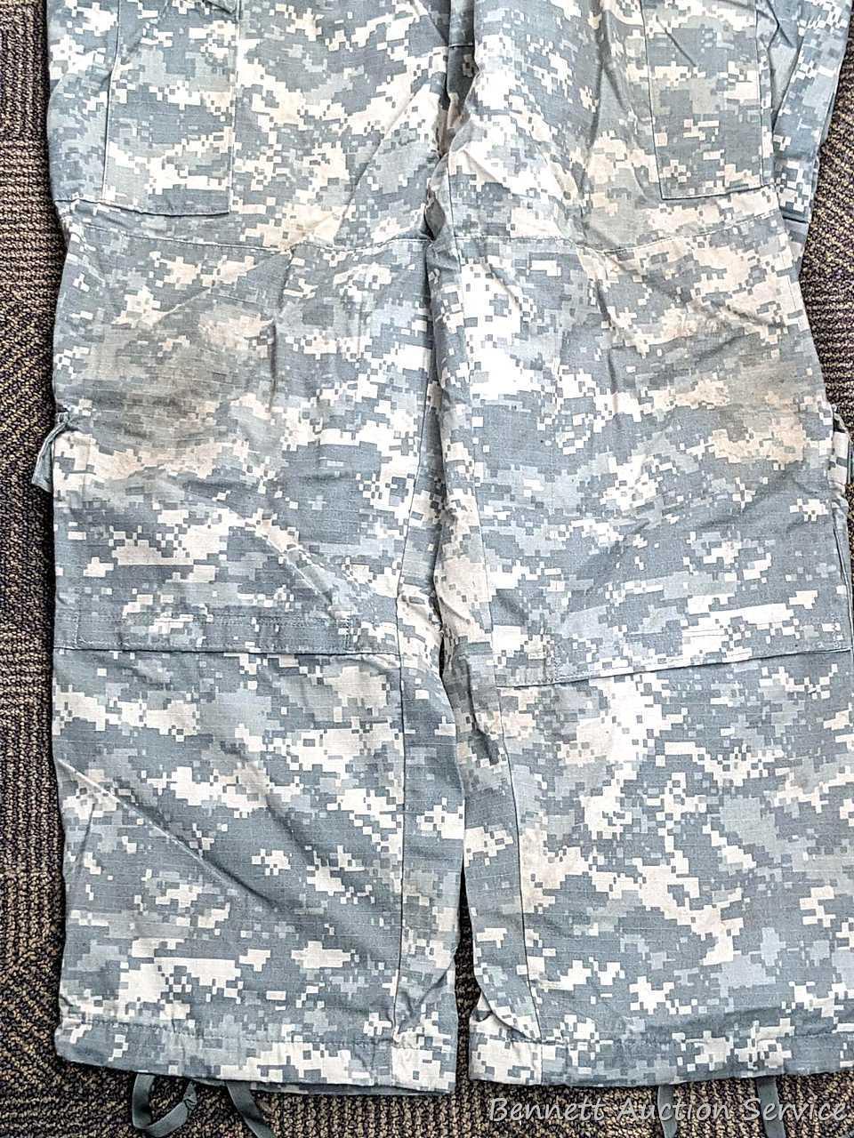 US Military Army digital camouflage combat uniform and two extra coats of the same type. All coats
