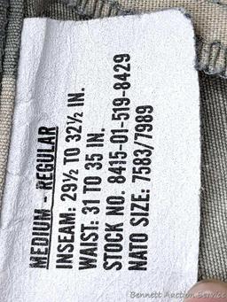 US Military Army digital camouflage combat uniform and two extra coats of the same type. All coats