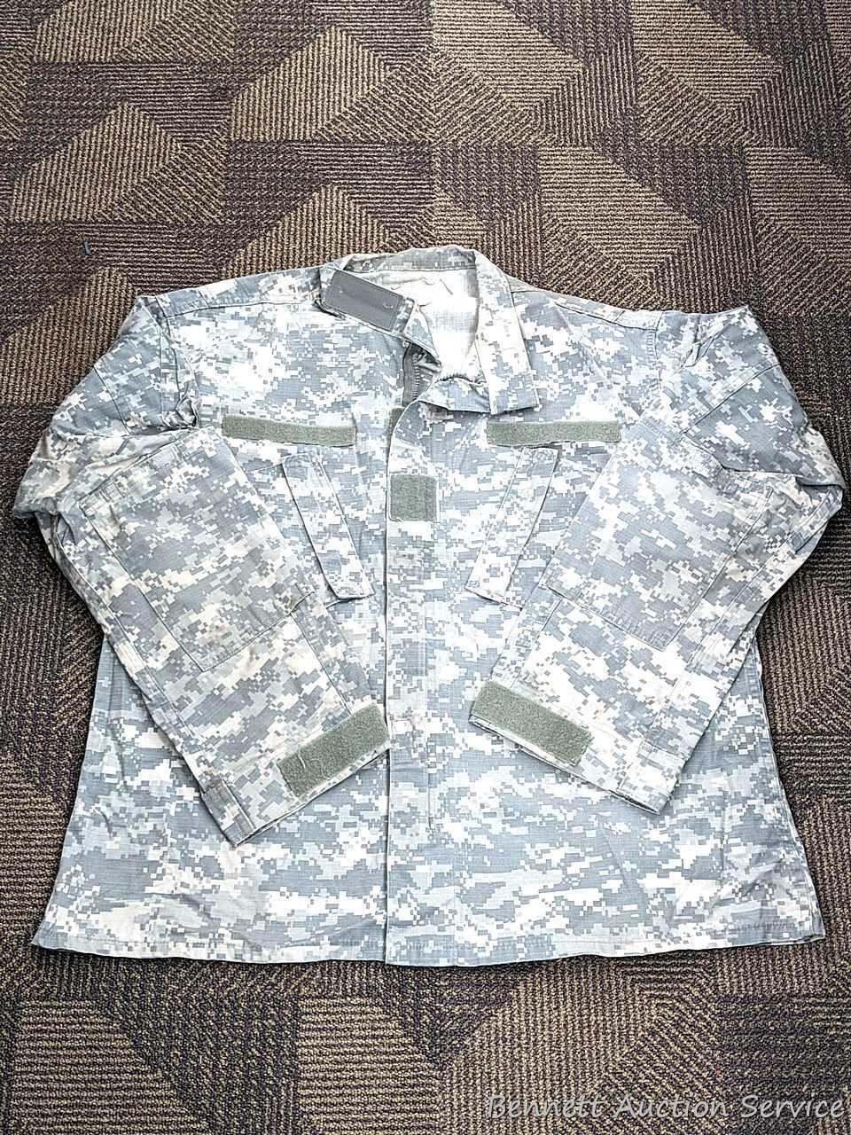 US Military Army digital camouflage combat uniform and two extra coats of the same type. All coats