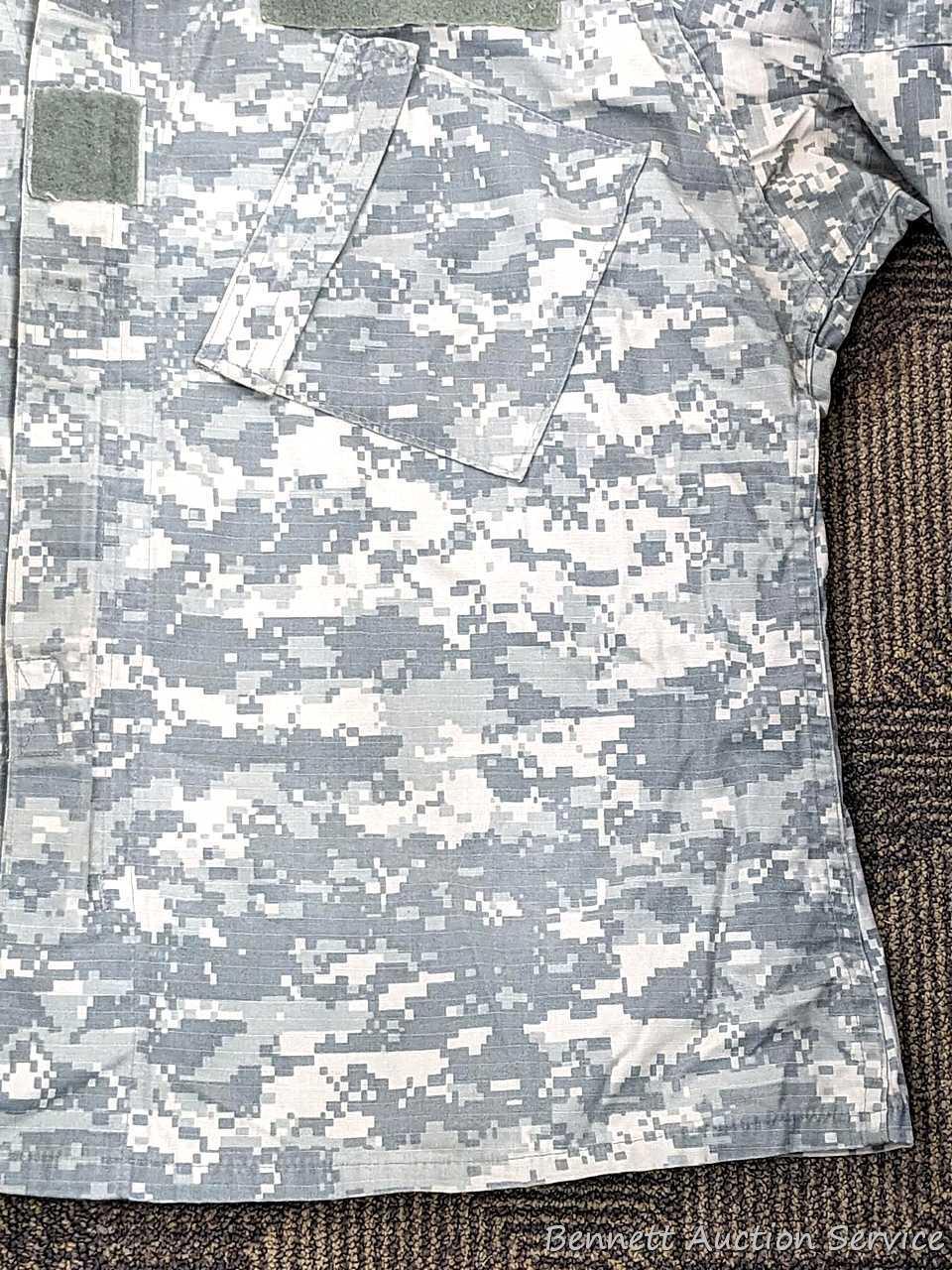 US Military Army digital camouflage combat uniform and two extra coats of the same type. All coats