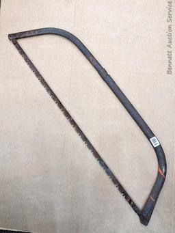 Bow saw is nearly 4' long.