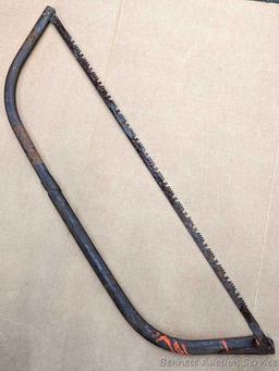 Bow saw is nearly 4' long.