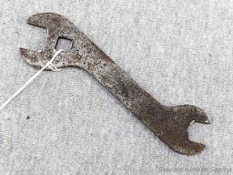 Vintage John Deer open end wrench with a 3/8" square hole. The wrench is 6" overall and is marked