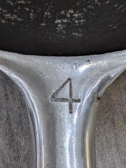 Griswold No. 4 cast iron skillet with nickel plating and large logo. Bottom marked Erie PA USA, 702.