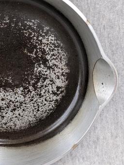 Griswold No. 4 cast iron skillet with nickel plating and large logo. Bottom marked Erie PA USA, 702.