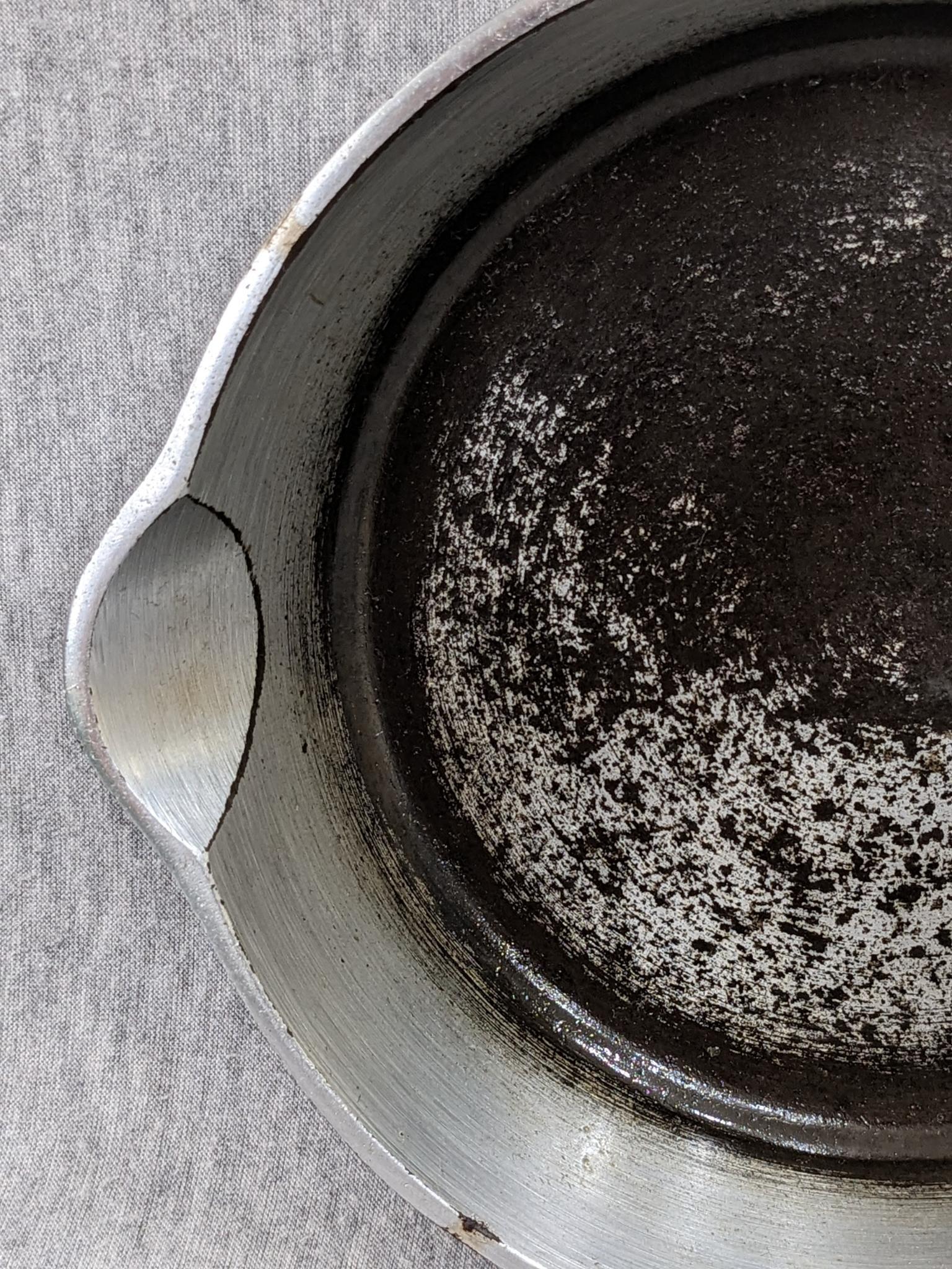 Griswold No. 4 cast iron skillet with nickel plating and large logo. Bottom marked Erie PA USA, 702.