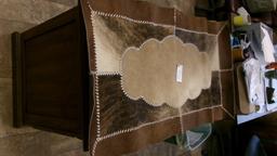 26" X 49" COWHIDE RUG, BEAR SKULL, 11 BEAR CLAWS, & A SHARK TOOTH