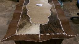 26" X 49" COWHIDE RUG, BEAR SKULL, 11 BEAR CLAWS, & A SHARK TOOTH