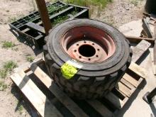 2- 10.0 X 16.5 SKID LOADER TIRES on 8 BOLT RIMS