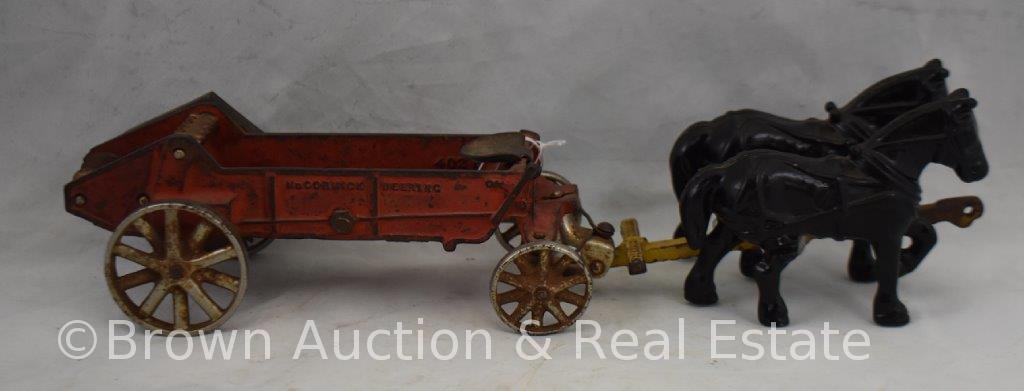 Arcade Cast Iron "McCormick-Deering" manure spreader pulled by (2) horses