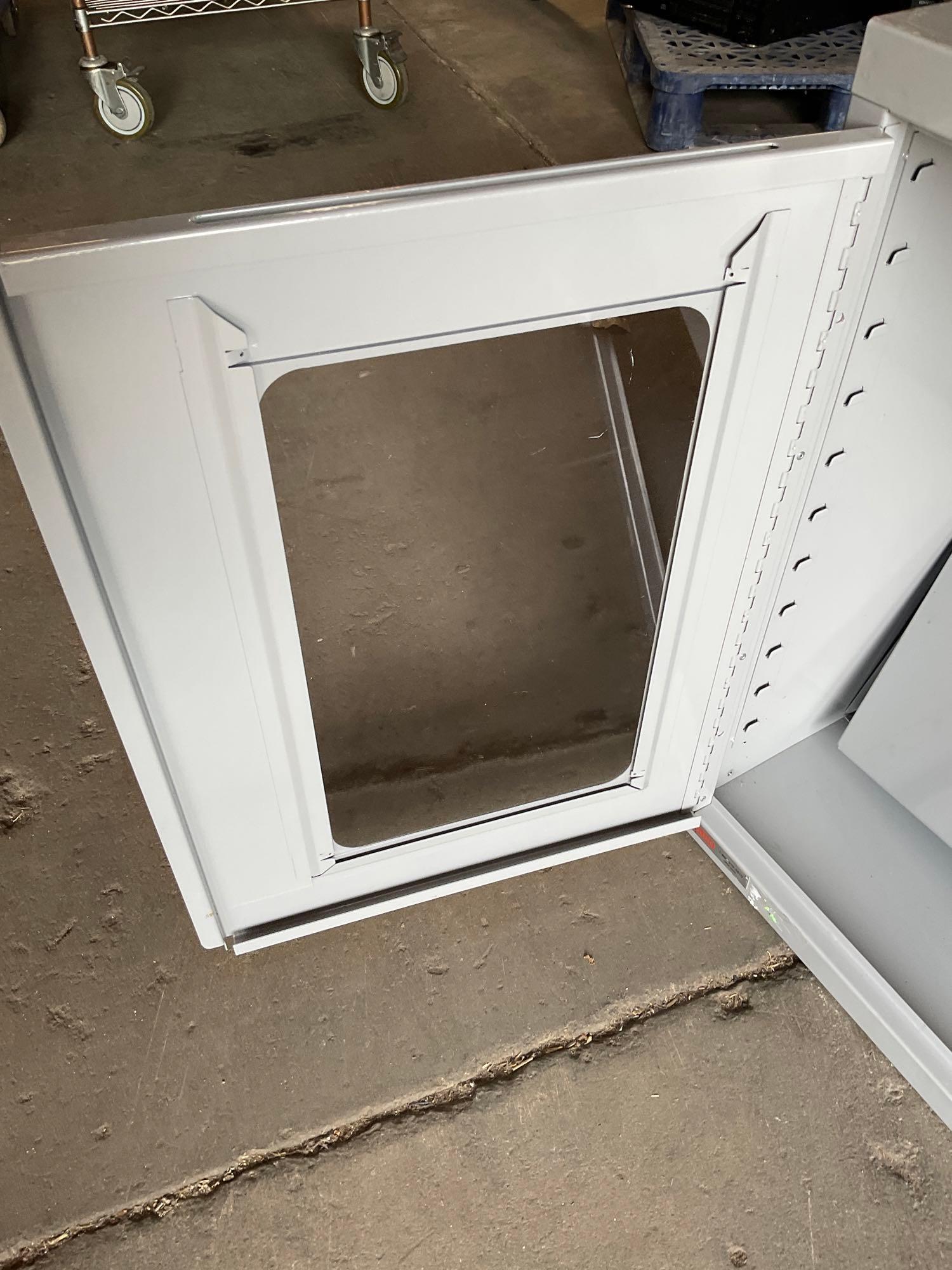 Uline two door, two shelf storage metal cabinet. 27" x 36" x14"