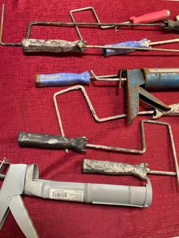 Assorted roller handles & caulk guns. 15 pieces