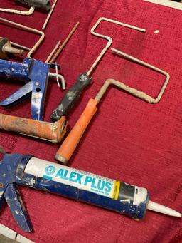 Assorted roller handles & caulk guns. 15 pieces