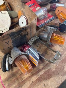 Assorted tail lights. parts, etc. Over 25 pieces