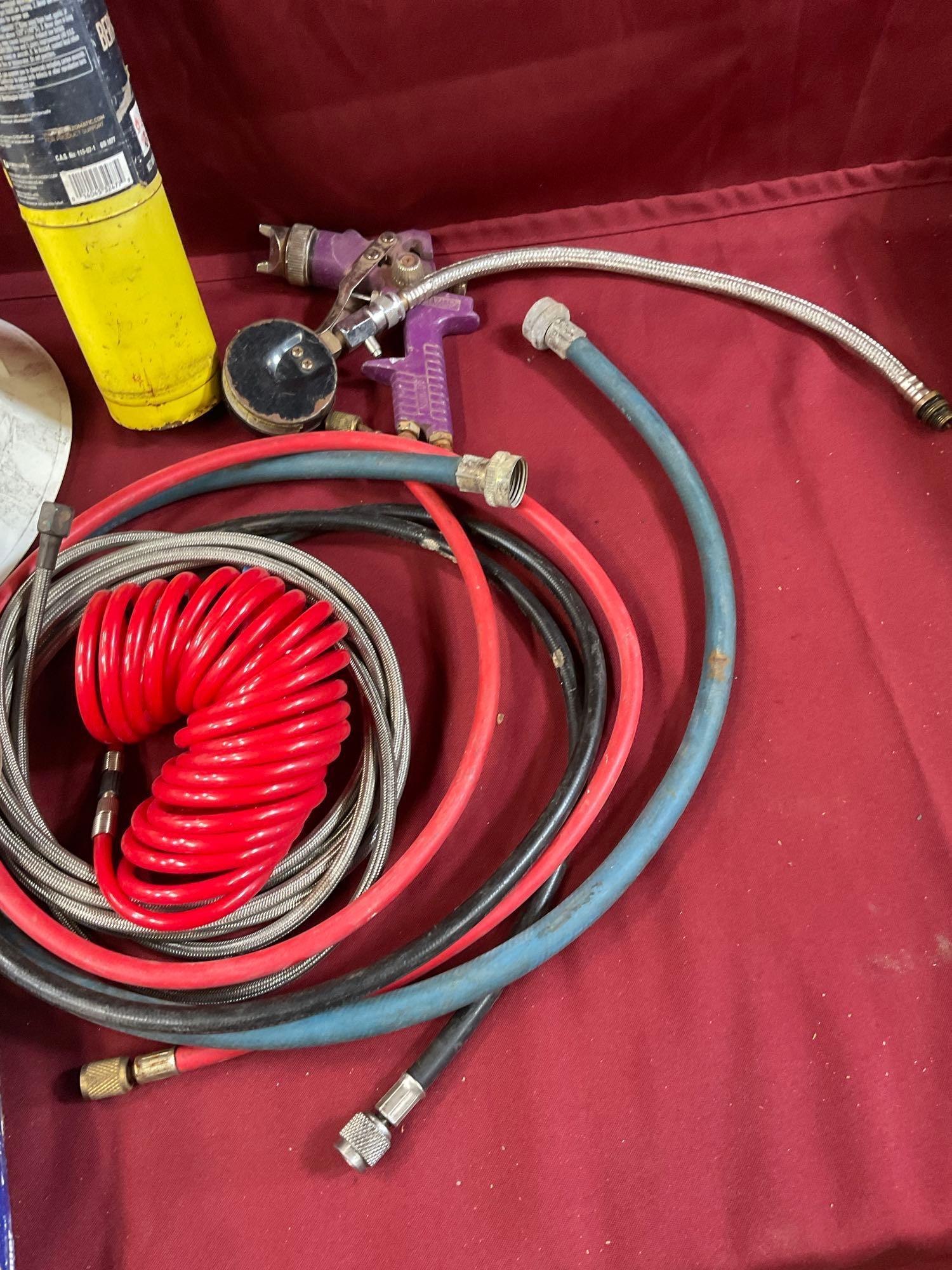 Assorted items. Gauge, hoses, air gun, helmet, etc