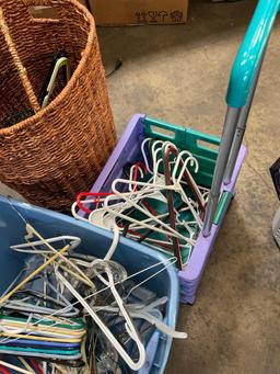 Assorted hangers, laundry basket, rolling cart