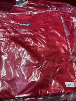 New, individually packed, small, men's, medium, red jersey. 25 pieces