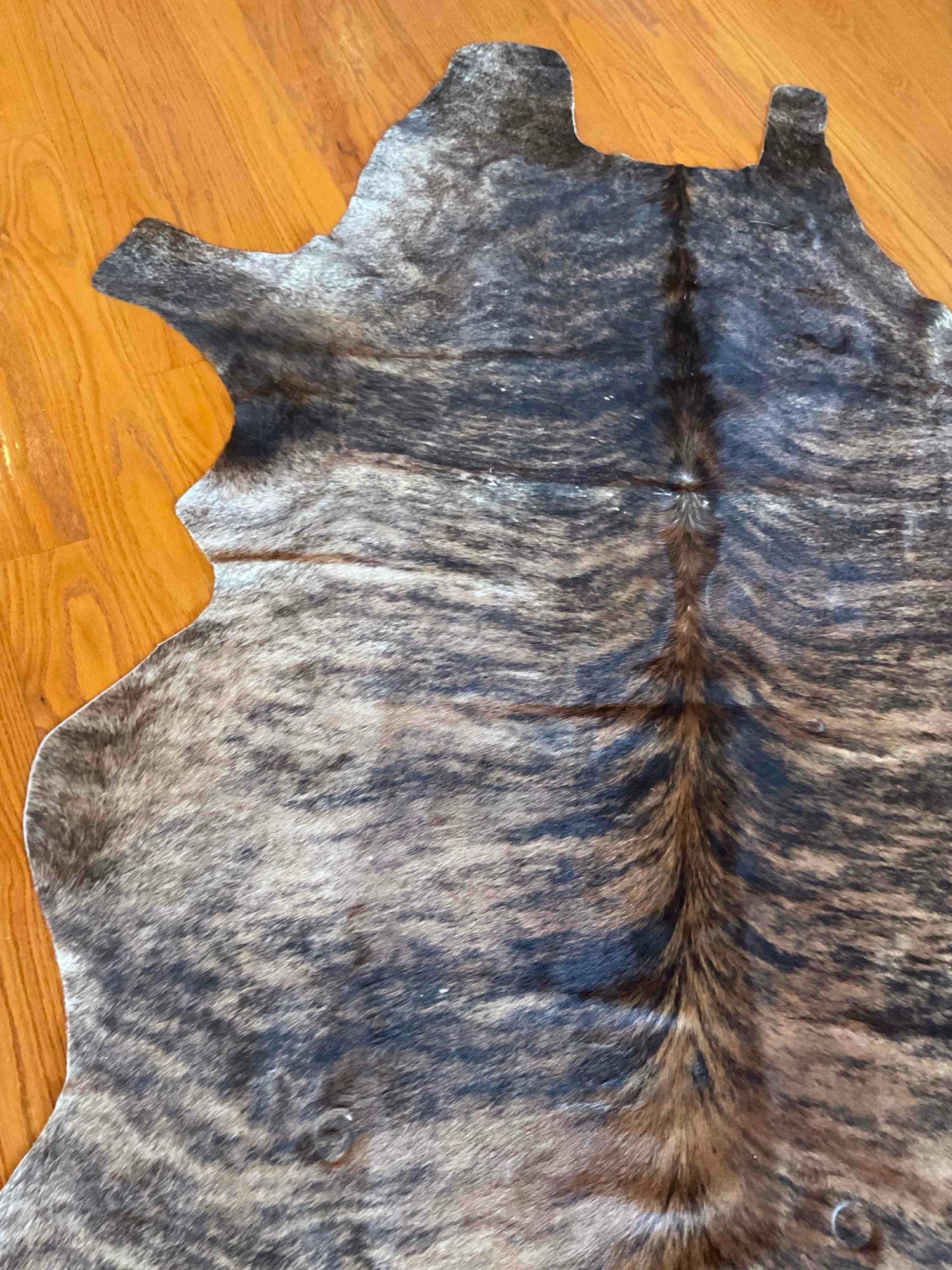 Animal hide area rug 7' x 74"