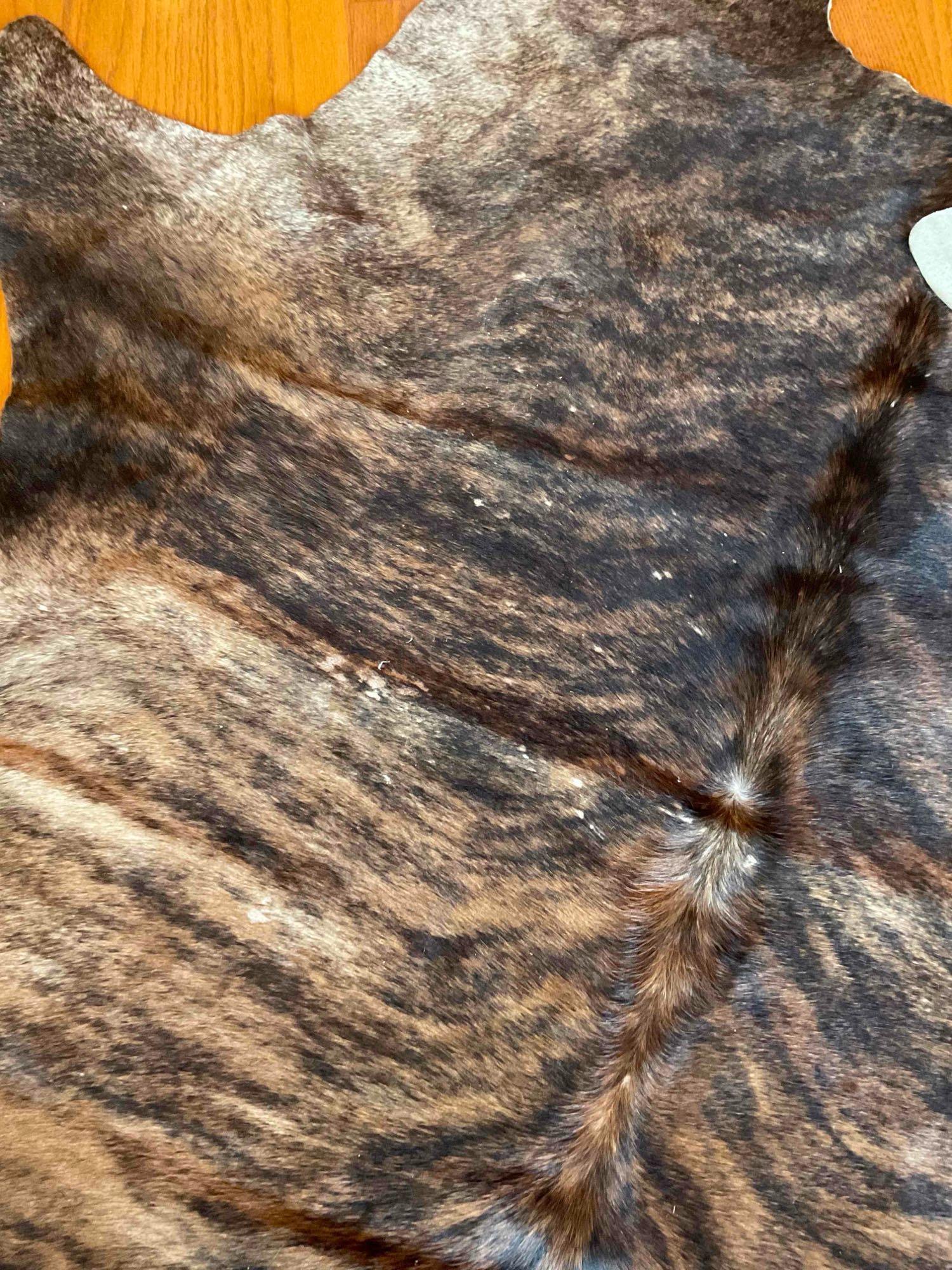 Animal hide area rug 7' x 74"