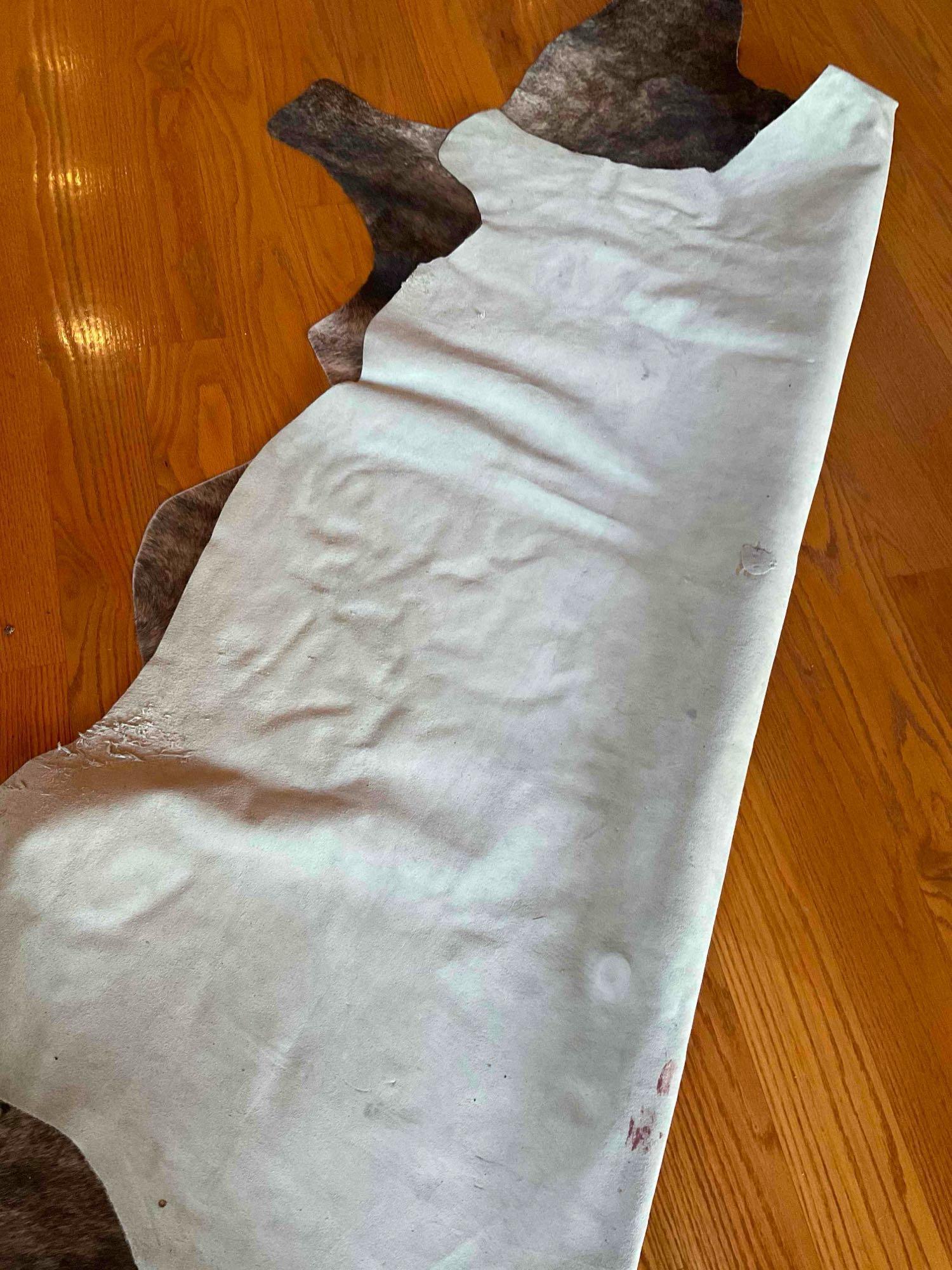 Animal hide area rug 7' x 74"