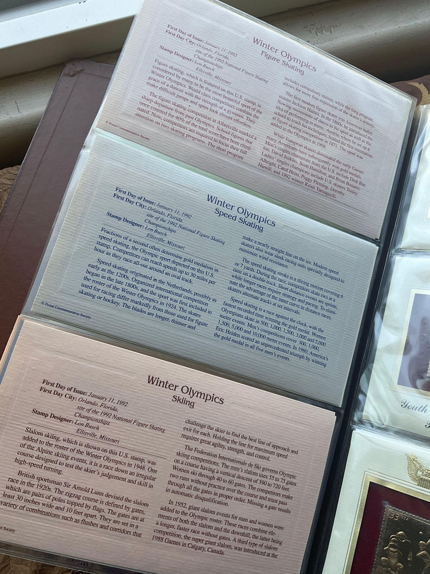 Golden Replica of Unites States stamps album with replicas on a gleaming surface 22kt gold & other