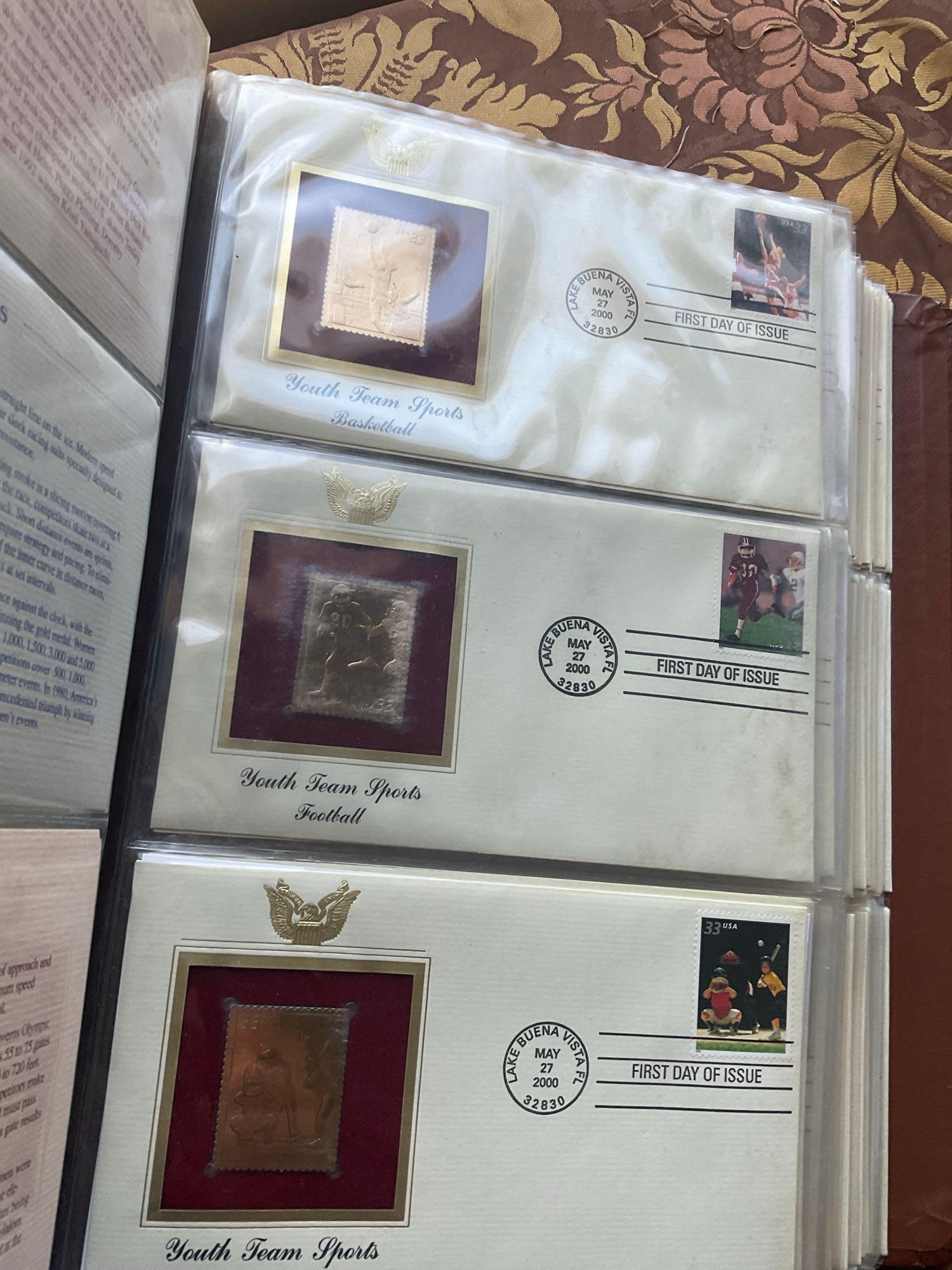 Golden Replica of Unites States stamps album with replicas on a gleaming surface 22kt gold & other