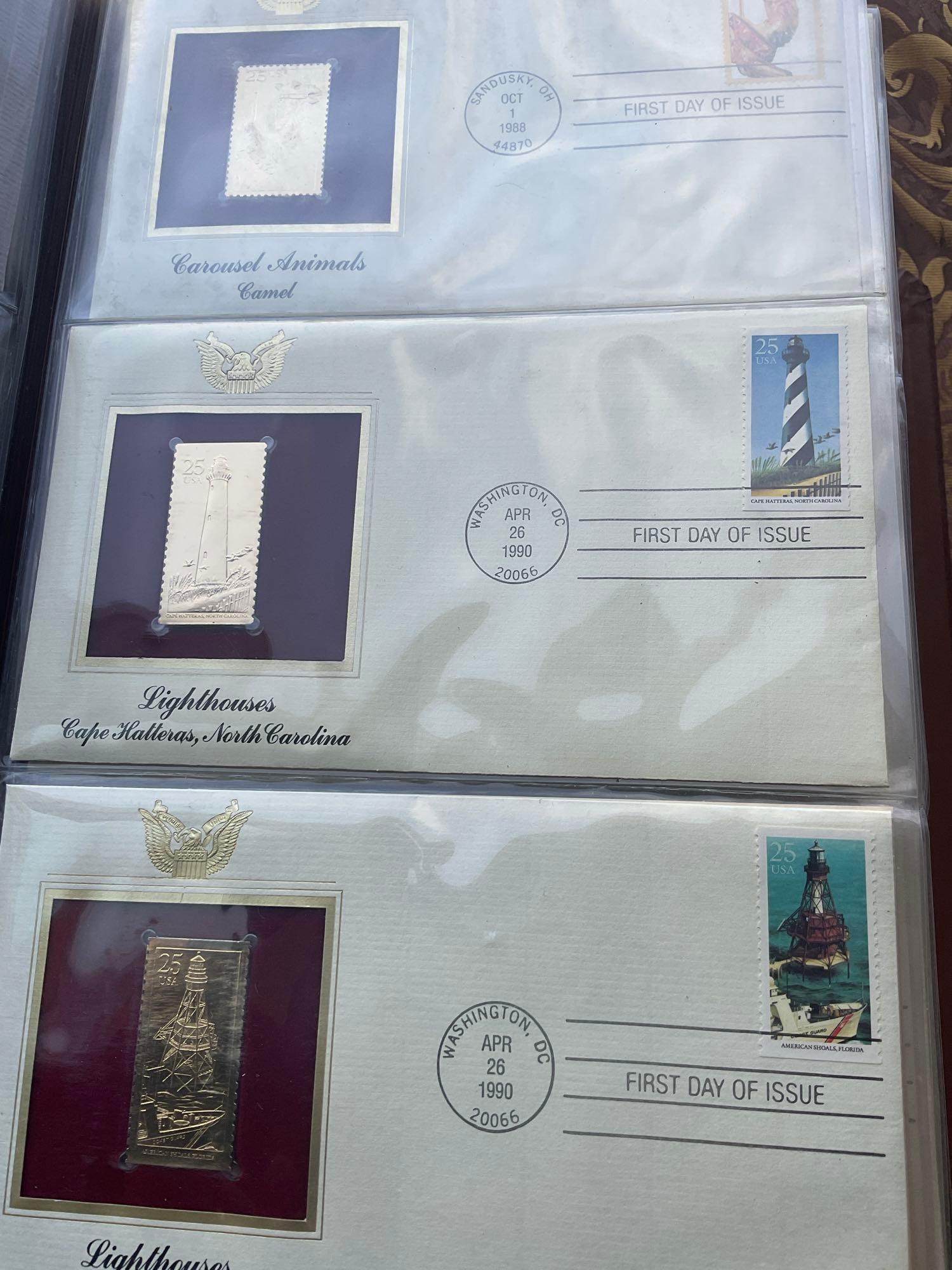 Golden Replica of Unites States stamps album with replicas on a gleaming surface 22kt gold & other