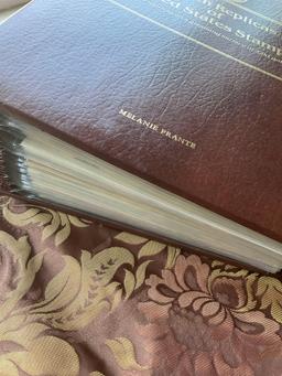 Golden Replica of Unites States stamps album with replicas on a gleaming surface 22kt gold & other