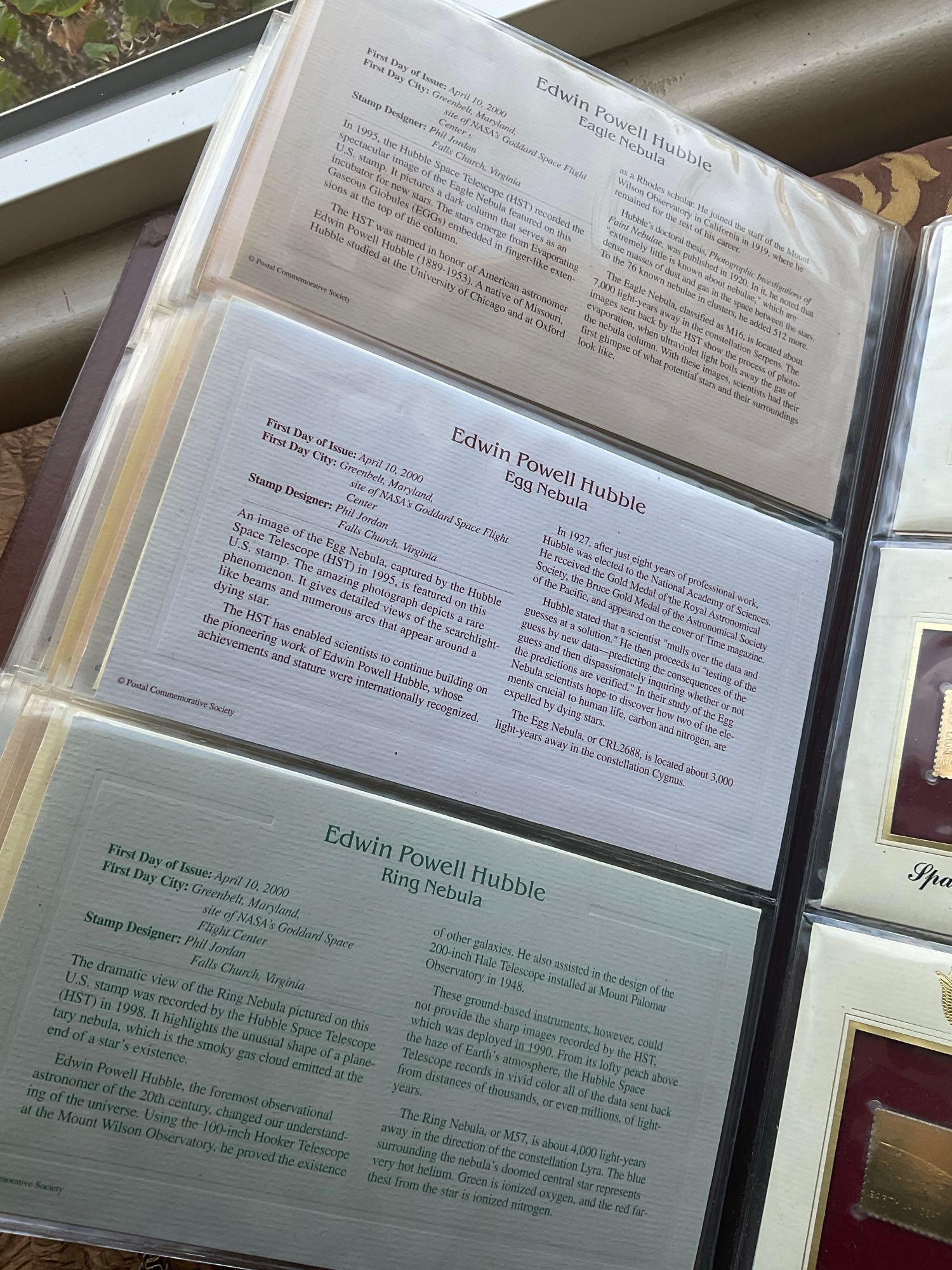 Golden Replica of Unites States stamps album with replicas on a gleaming surface 22kt gold & other