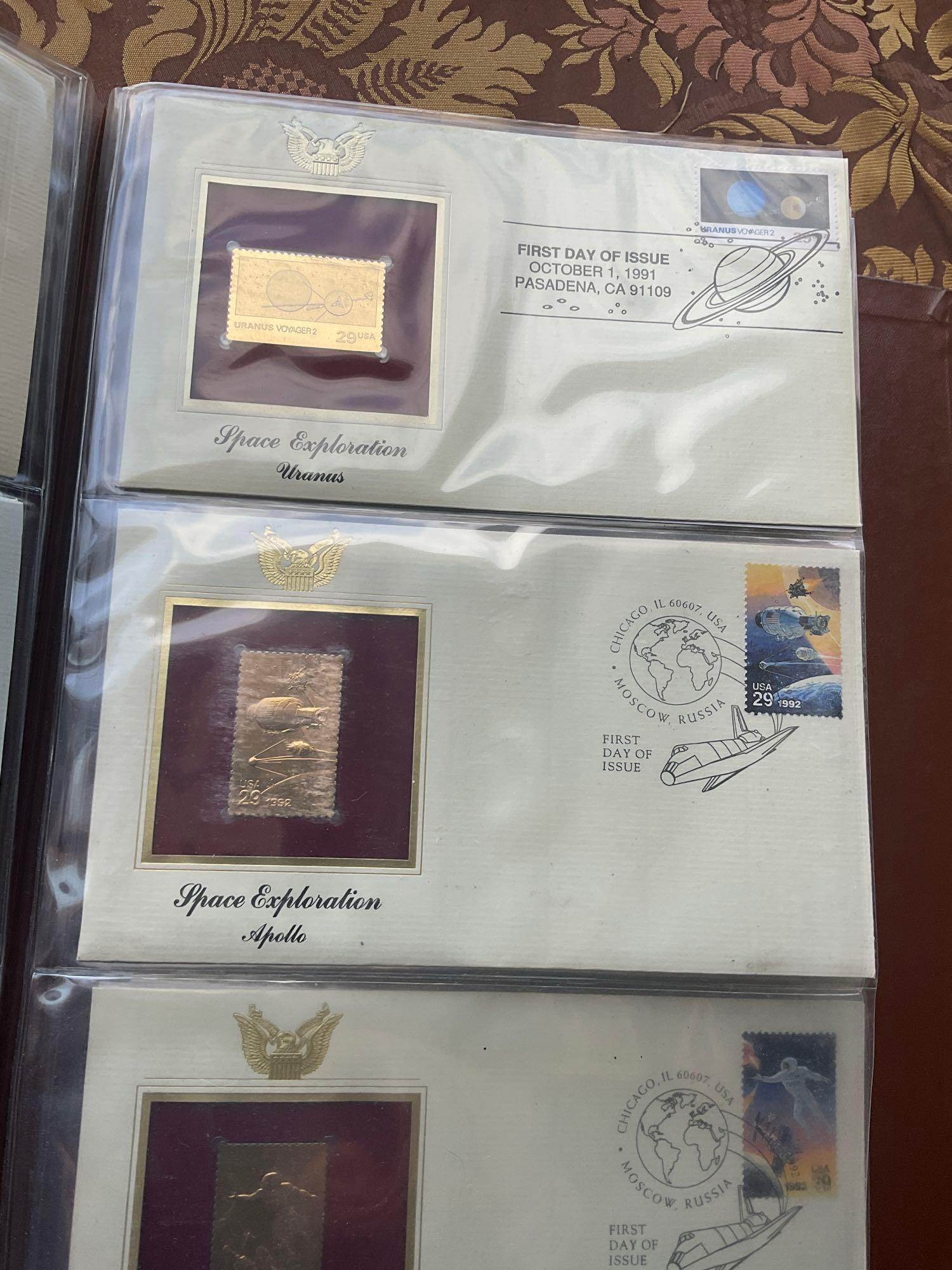 Golden Replica of Unites States stamps album with replicas on a gleaming surface 22kt gold & other