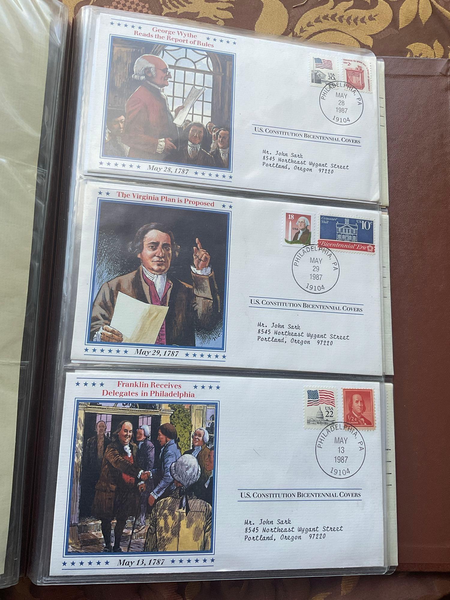Golden Replica of Unites States stamps album with replicas on a gleaming surface 22kt gold & other