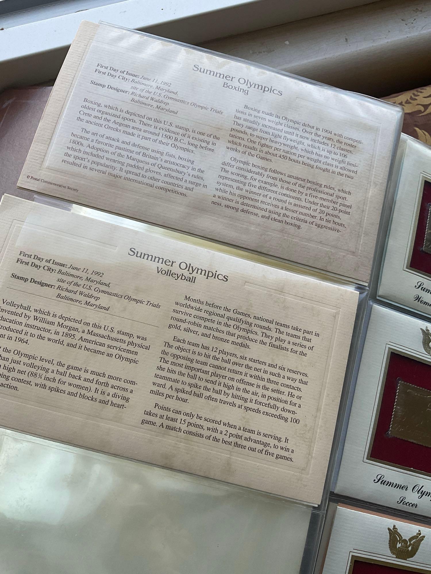 Golden Replica of Unites States stamps album with replicas on a gleaming surface 22kt gold & other