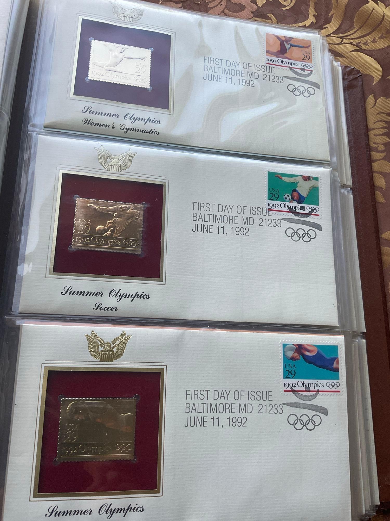 Golden Replica of Unites States stamps album with replicas on a gleaming surface 22kt gold & other