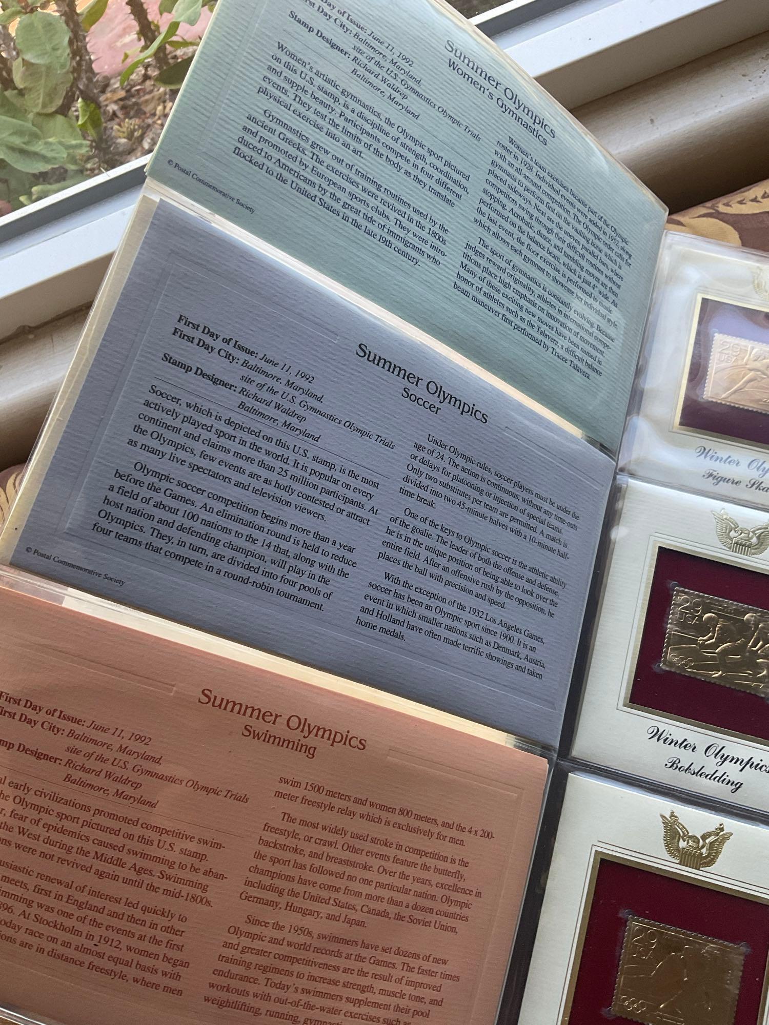 Golden Replica of Unites States stamps album with replicas on a gleaming surface 22kt gold & other