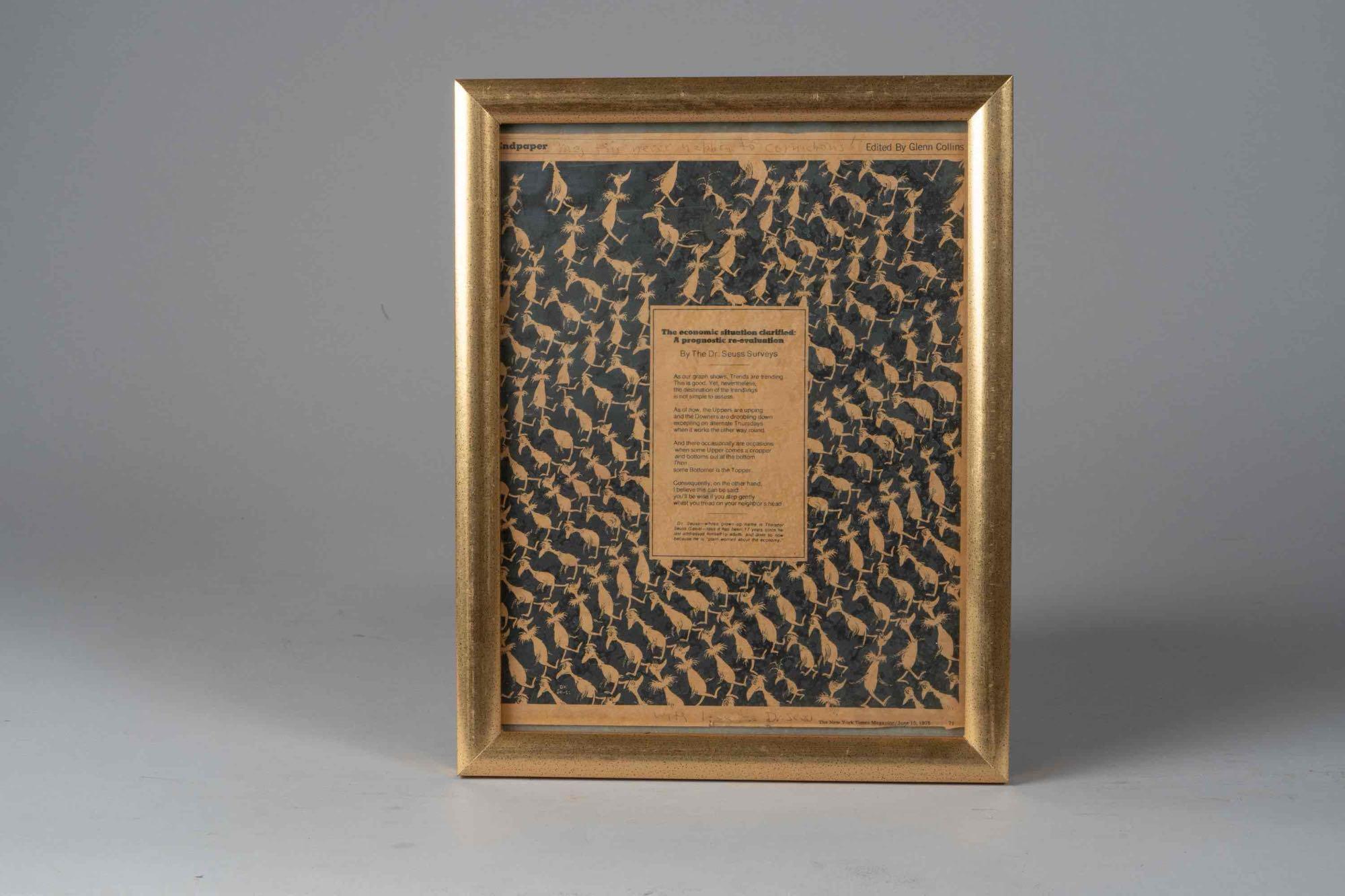 Framed copy of Dr. Seuss signed print.