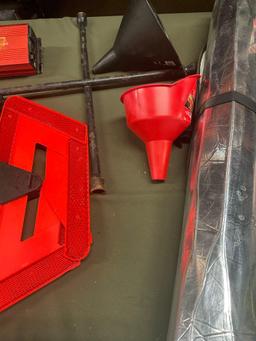 Power inverter, wrench, funnels, jumper cable, emergency triangle, sun shade. 7 pieces