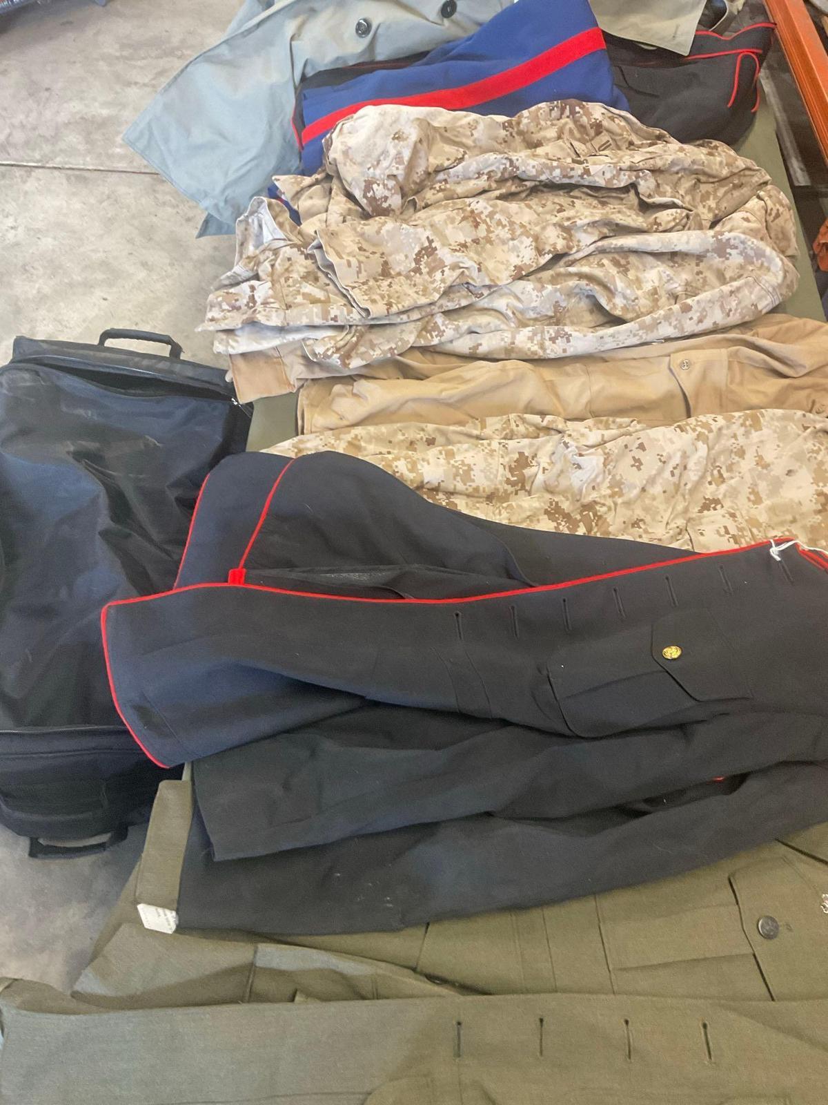 Large rolling bag, with tags all weather coat 42R, coat 44xs with pants 33s, with tags coat 40r, 42L