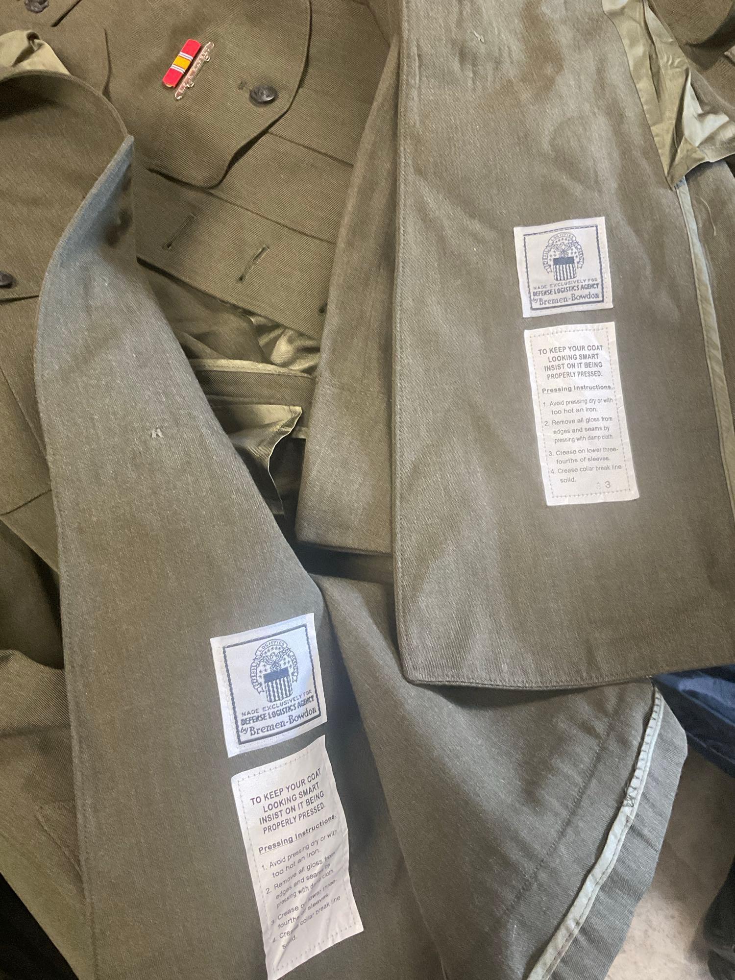 Large rolling bag, with tags all weather coat 42R, coat 44xs with pants 33s, with tags coat 40r, 42L