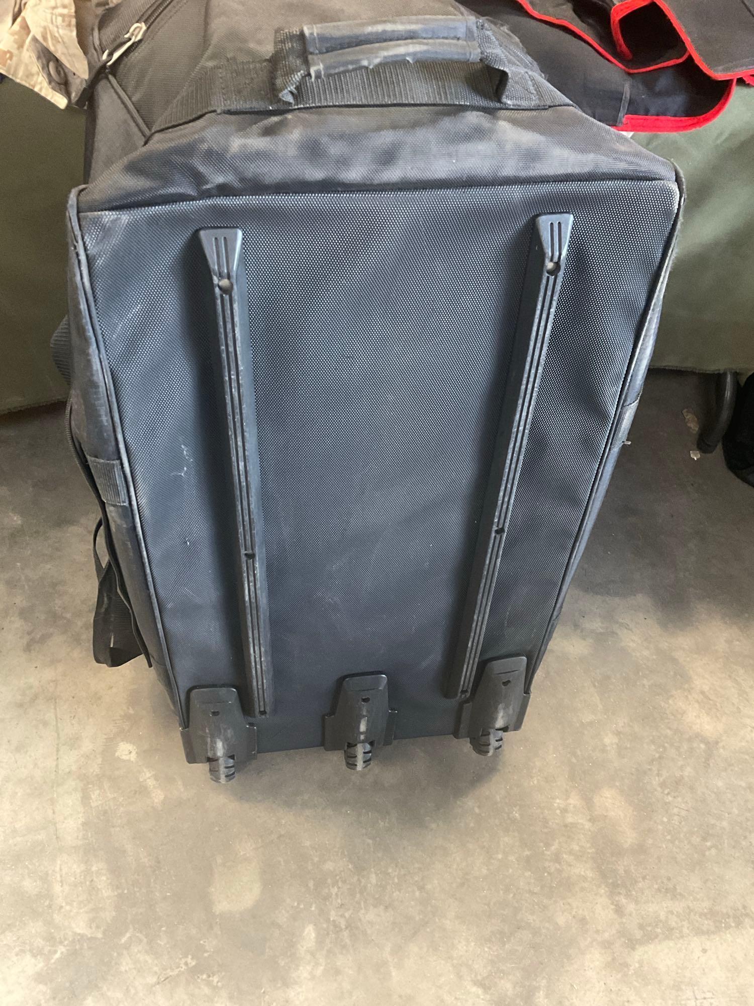 Large rolling bag, with tags all weather coat 42R, coat 44xs with pants 33s, with tags coat 40r, 42L