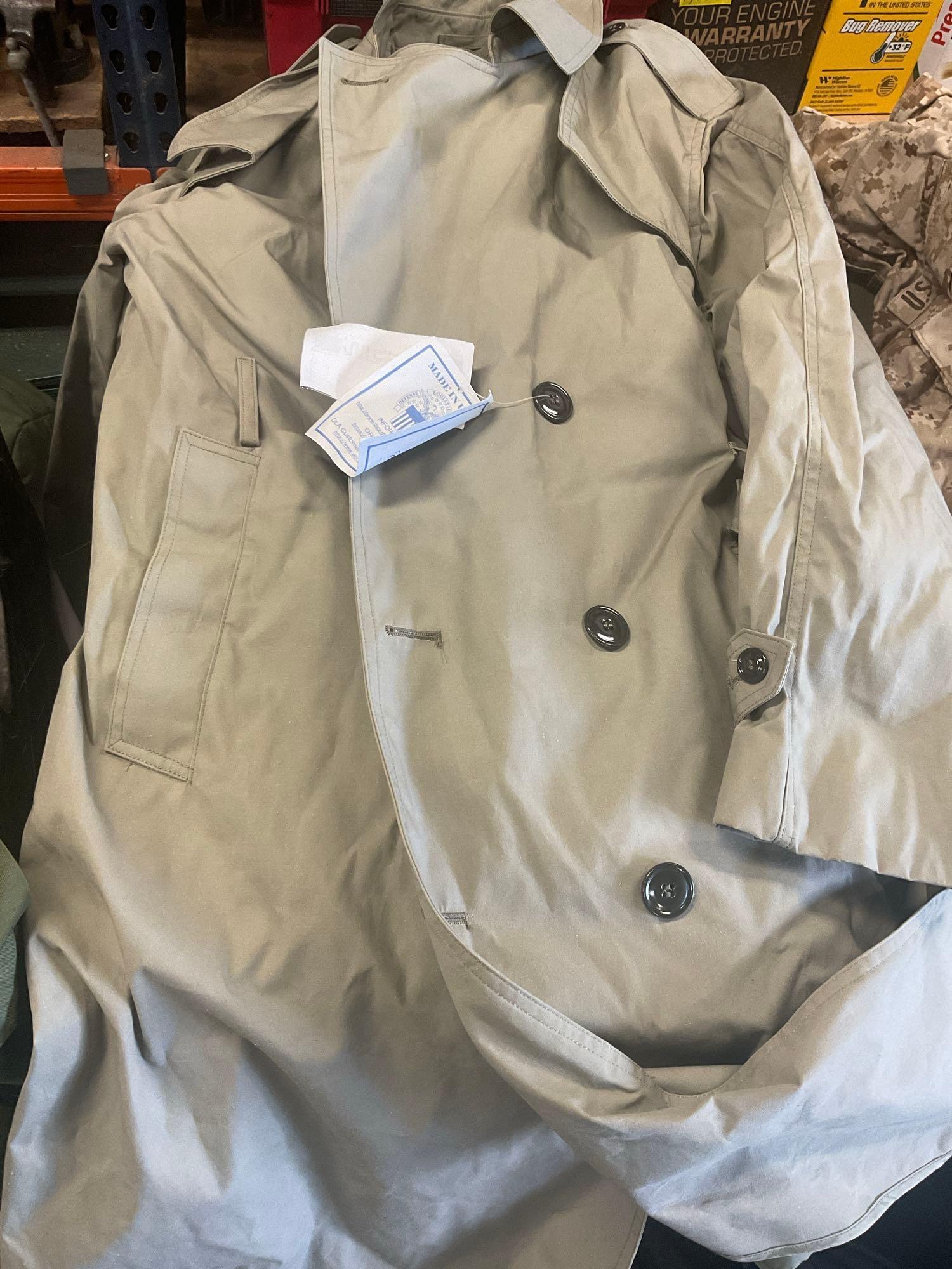 Large rolling bag, with tags all weather coat 42R, coat 44xs with pants 33s, with tags coat 40r, 42L