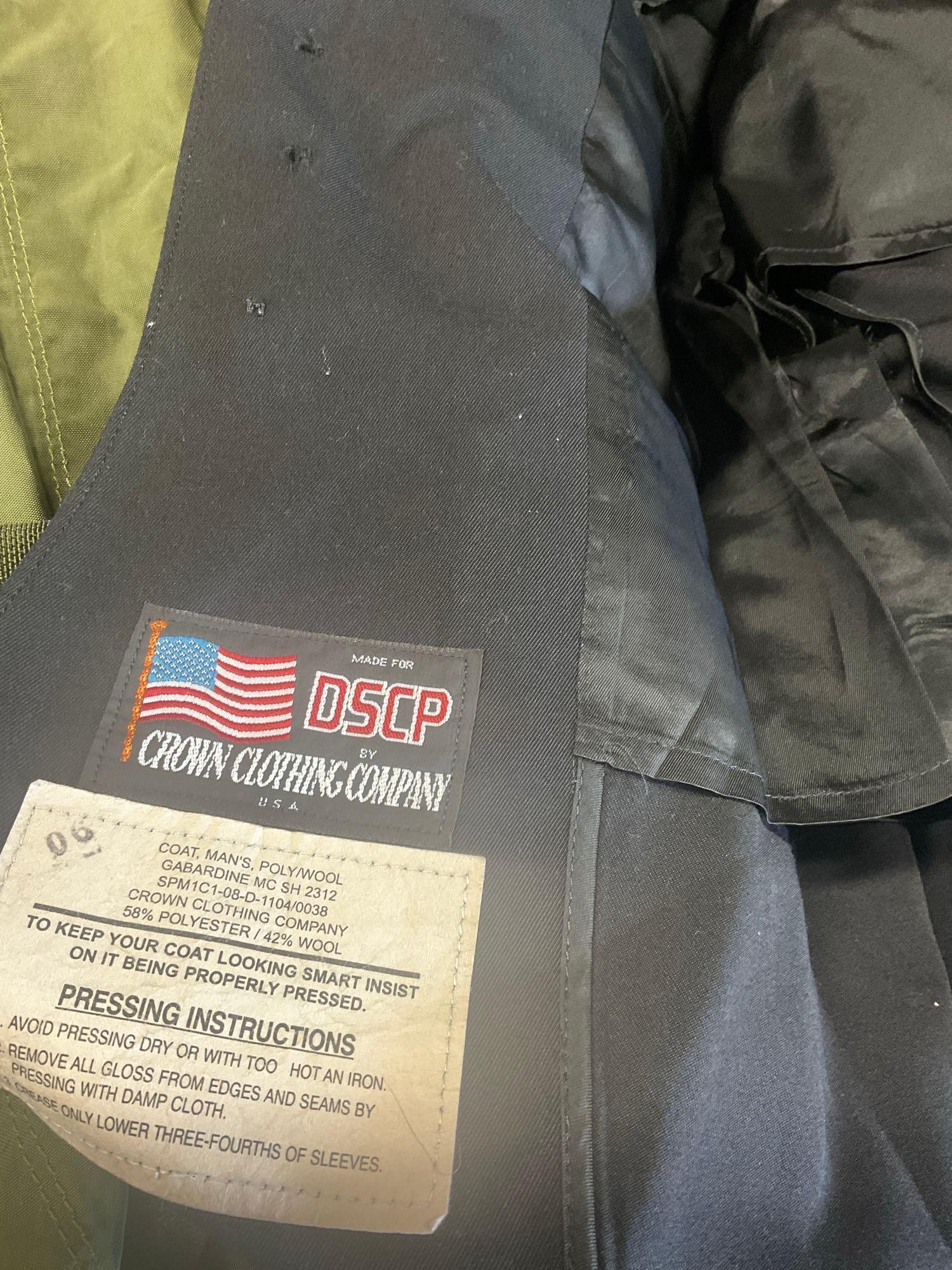 Large rolling bag, with tags all weather coat 42R, coat 44xs with pants 33s, with tags coat 40r, 42L