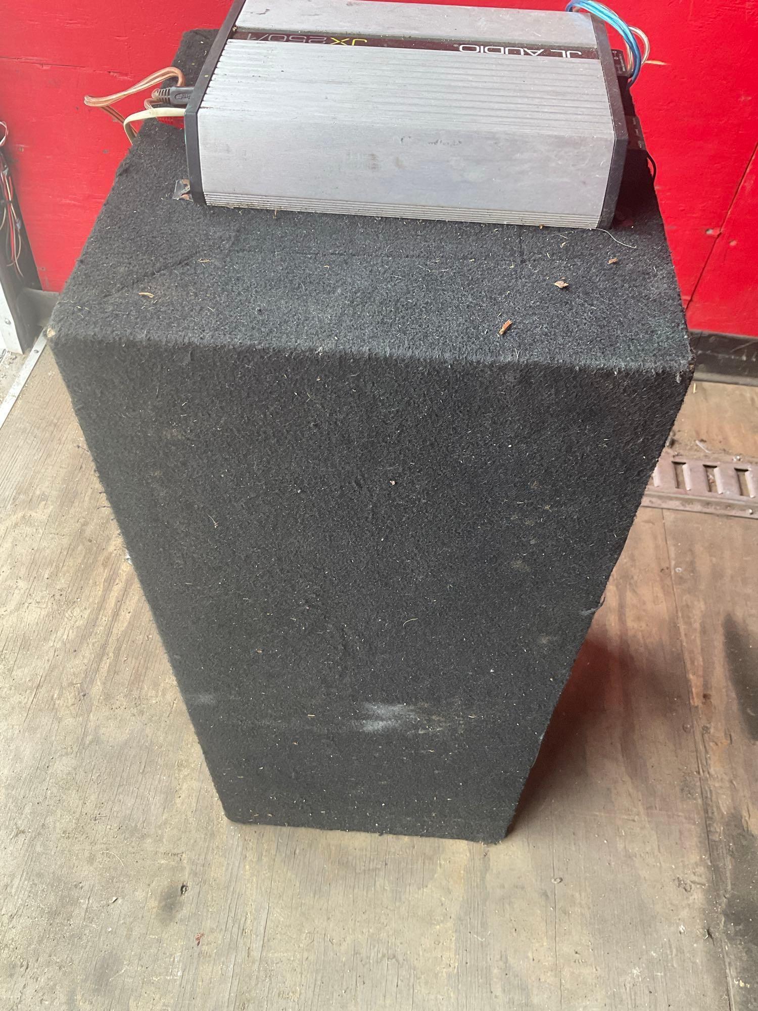 12" dual Sony Xplod subwoofer with JL Audio JX250/1 amplifier. Box 30" x 13" x 14"