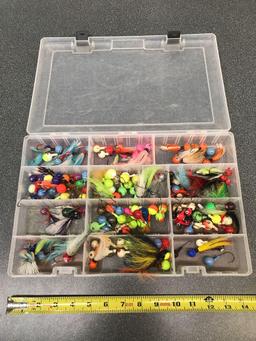 Tackle box full of large lead jigs