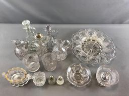 Group of clear pressed glass cruets and more