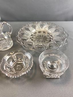Group of clear pressed glass cruets and more